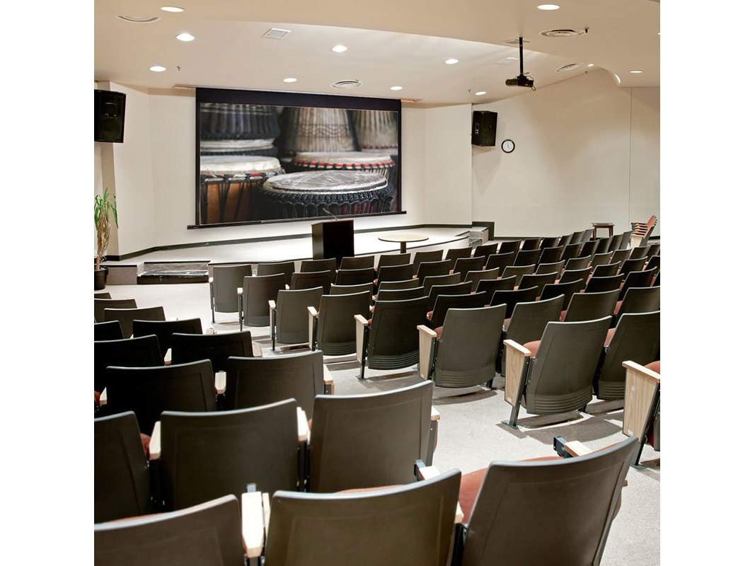 Draper Ultimate Access XL E projection screen installed in an auditorium